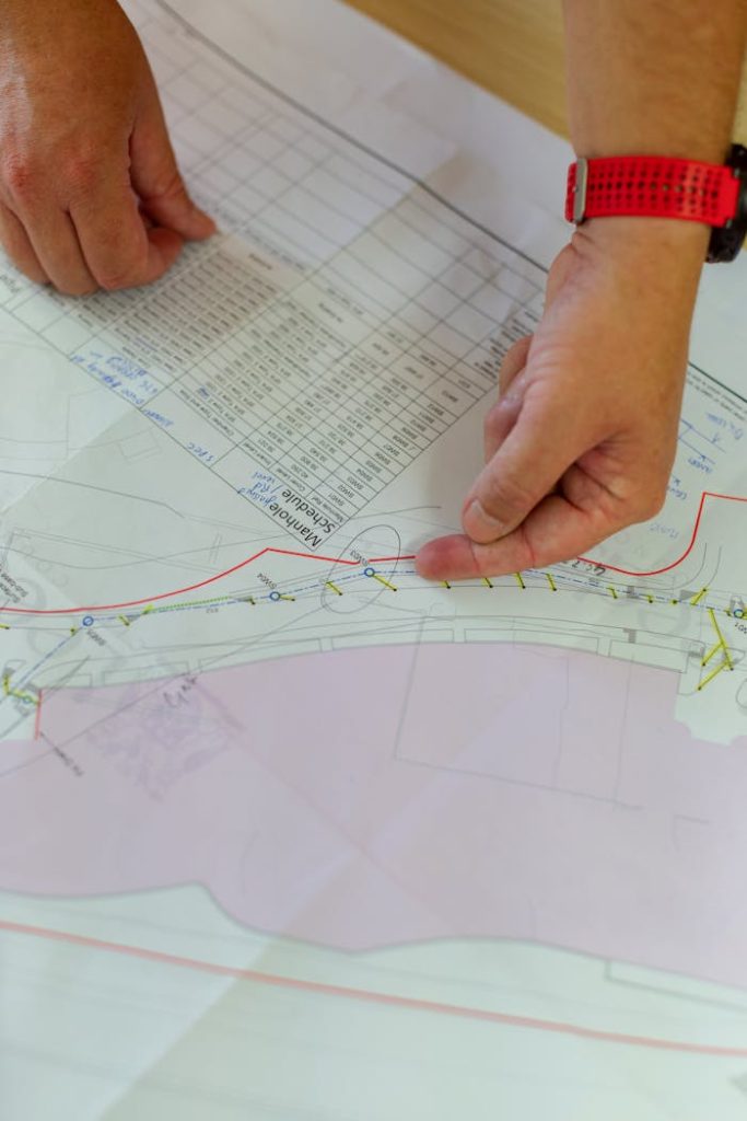 civil-engineer-looking-at-blueprint-3862628 Civil Engineer Looking at Blueprint